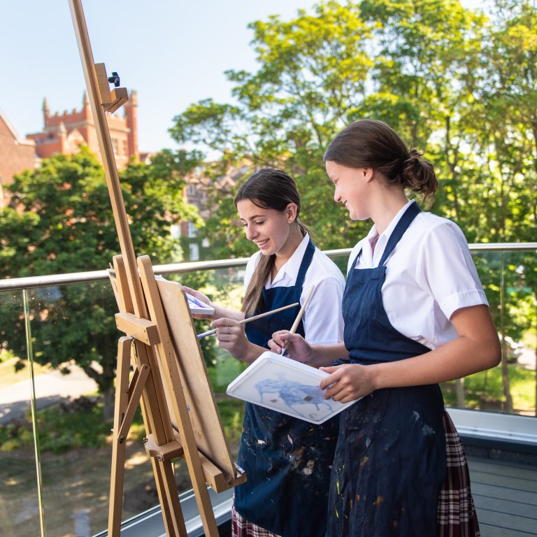 students setting up easels