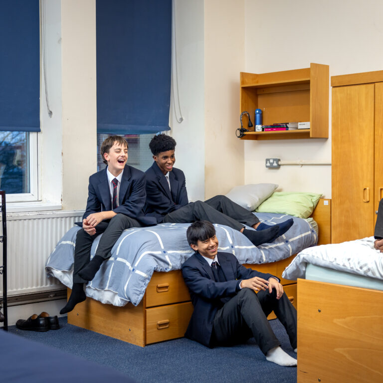 Four boys in boarding bedroom