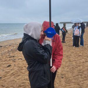 Two students with measuring stick on Ramsgate beach