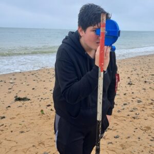 Girl with measuring stick on Ramsgate Beach