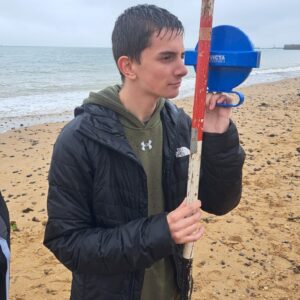 Boy with measuring stick on Ramsgate Beach
