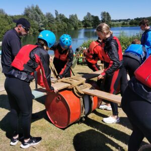 Students building rafts