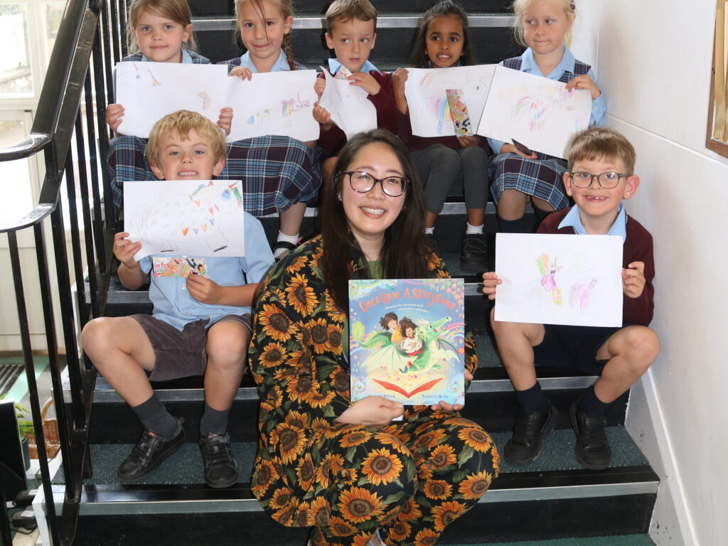 Natelle Quek with children and their drawings