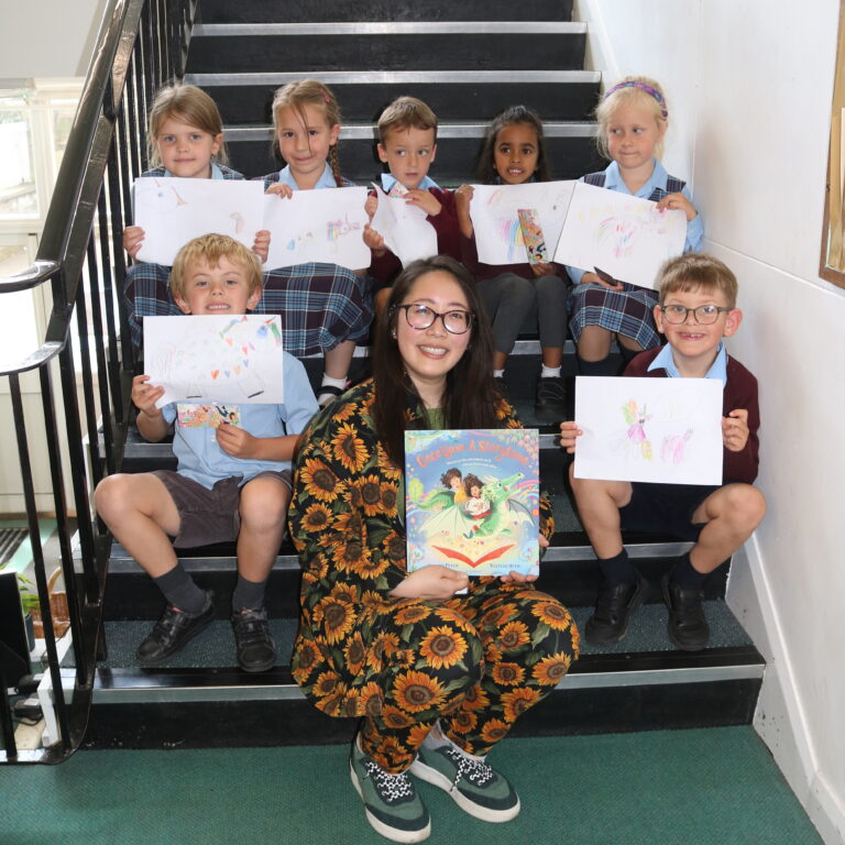 Natelle Quek with children and their drawings