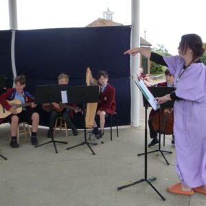 Children performing in bandstand