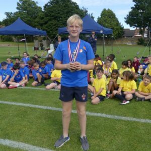 Boy in blue at school sports day