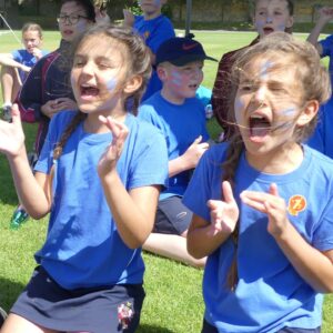 Two children cheering at sports day