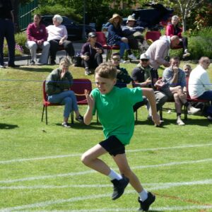 Boy in green running at sports day