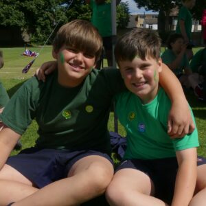 two boys in green t-shirts at school sports day