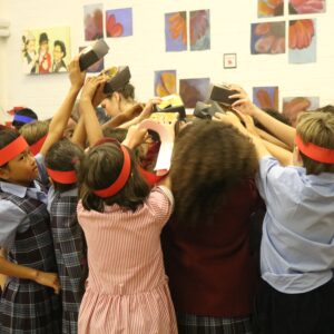 Children dancing in school hall