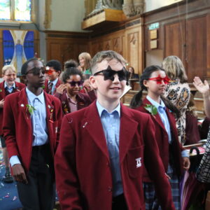 school children wearing star sunglasses