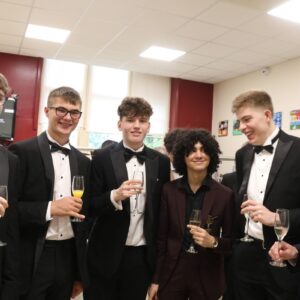 Group of student boys in black tie