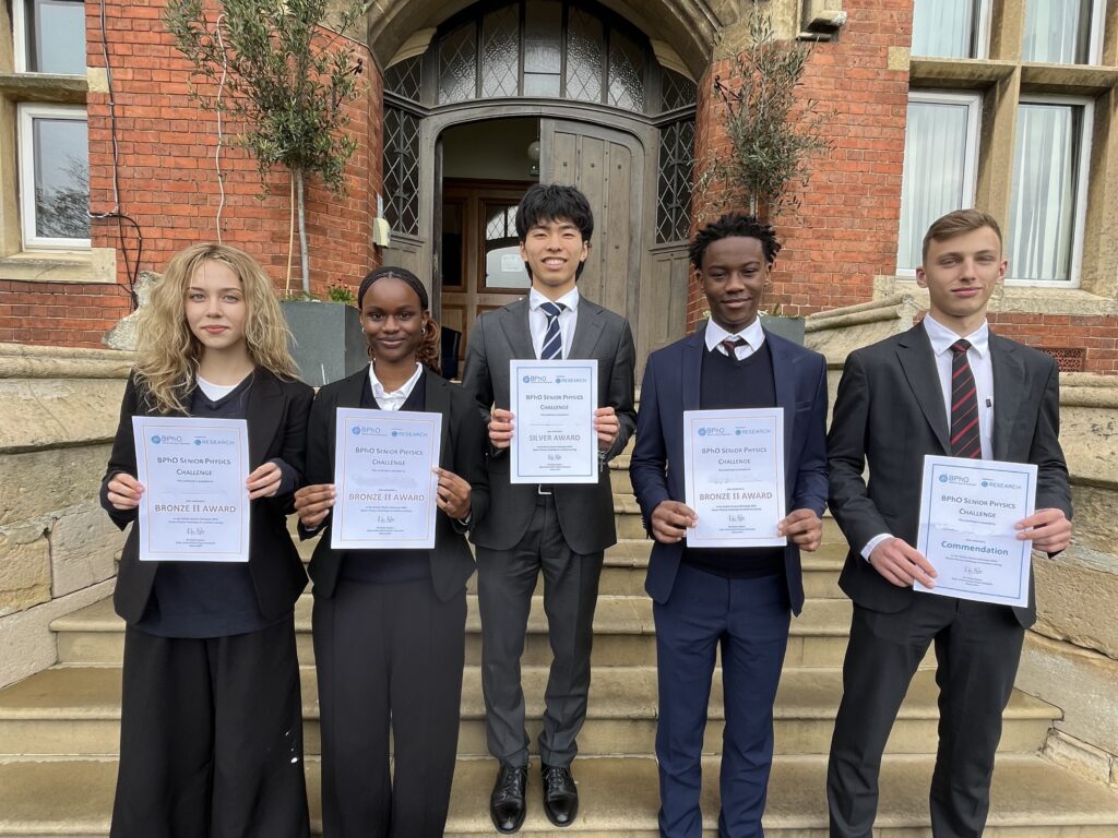 Students with physics olympiad certificates