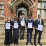 Students with physics olympiad certificates