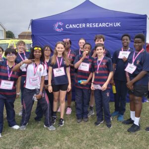 Staff and students run Race for Life in Herne Bay with medals