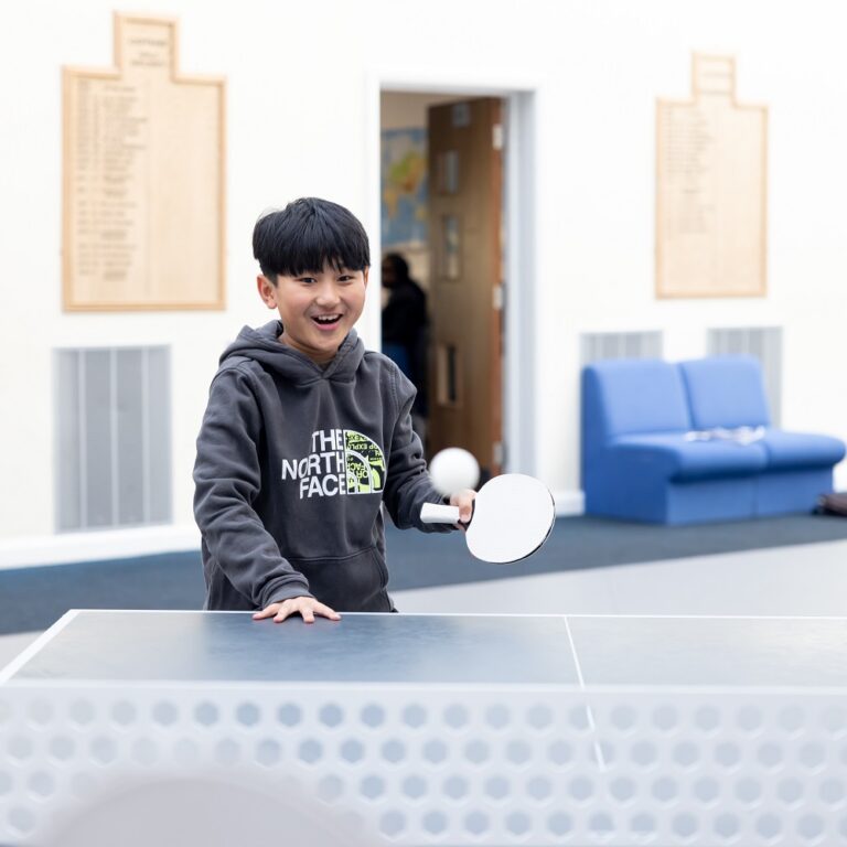 boy playing table tennis