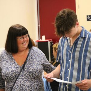 Mum and son smiling