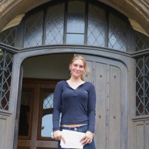 girl standing in front of door