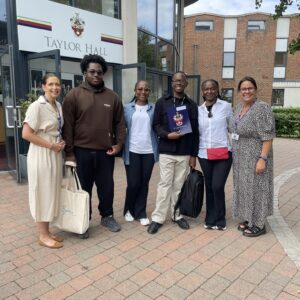 Family and school staff smiling